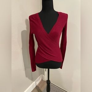 Women’s fitted cris cross front burgundy knit long sleeve top.  Size small.